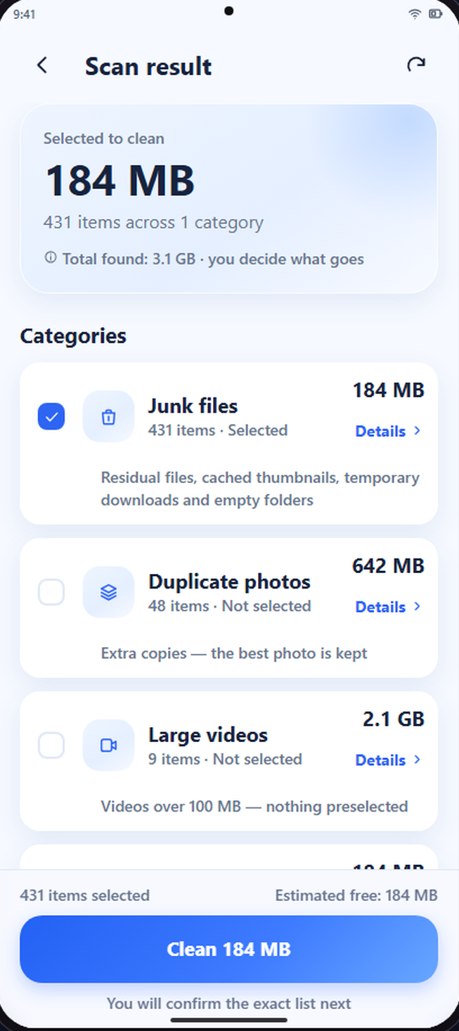 Scan result screen listing junk files selected at 184 MB, duplicate photos and large videos both marked as not selected.